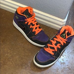 Size 7 purple and orange Air Jordan’s